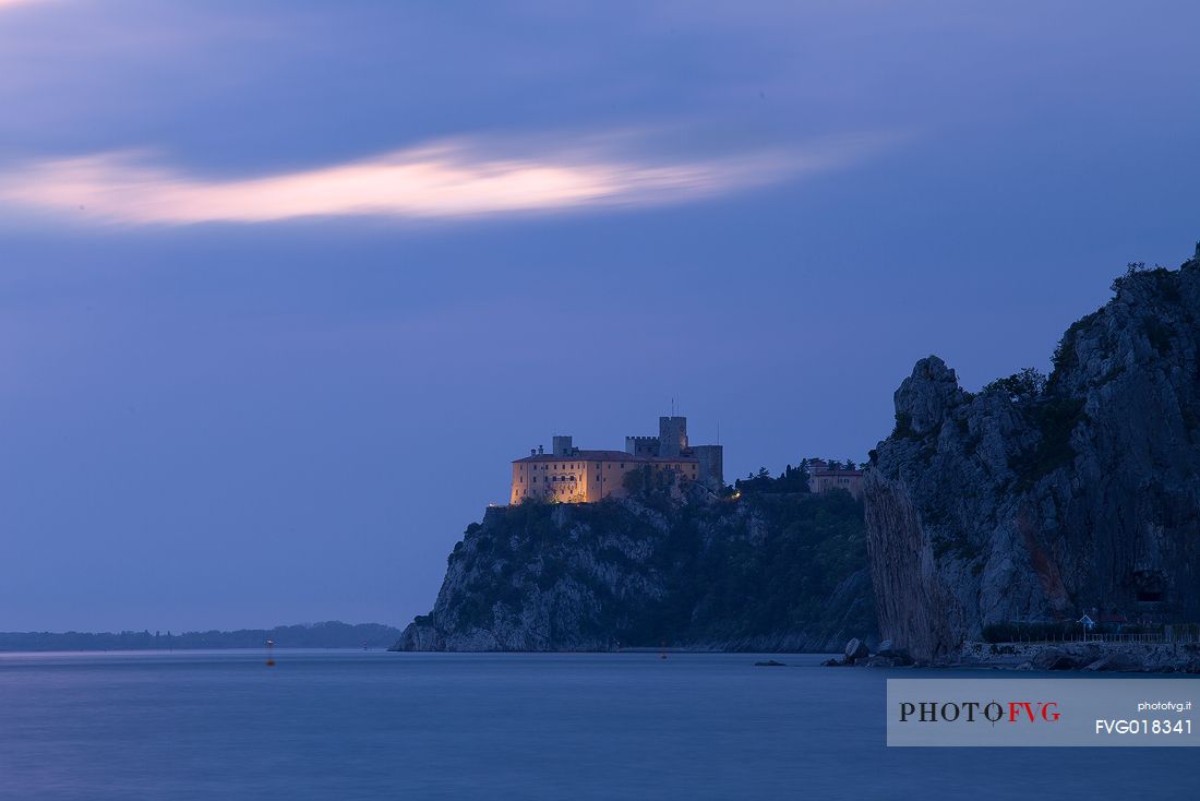 The Duino castle at blue hour photographed from Porto Piccolo's beach in Sistiana