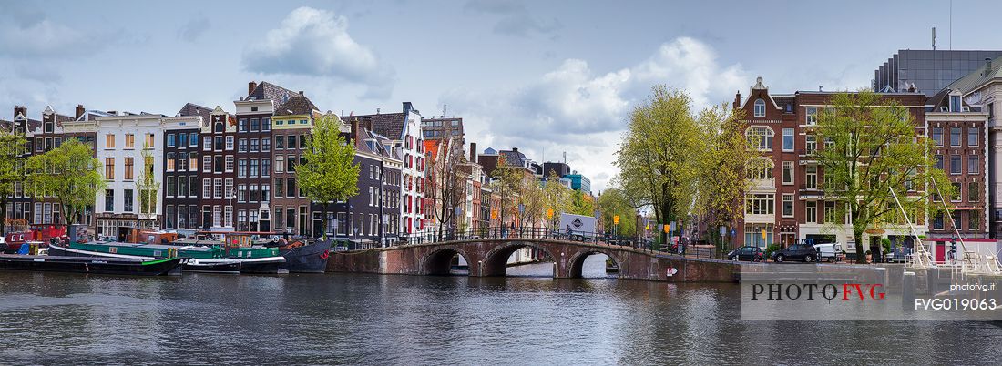 The Amstel River and the palaces along the canal in Amsterdam