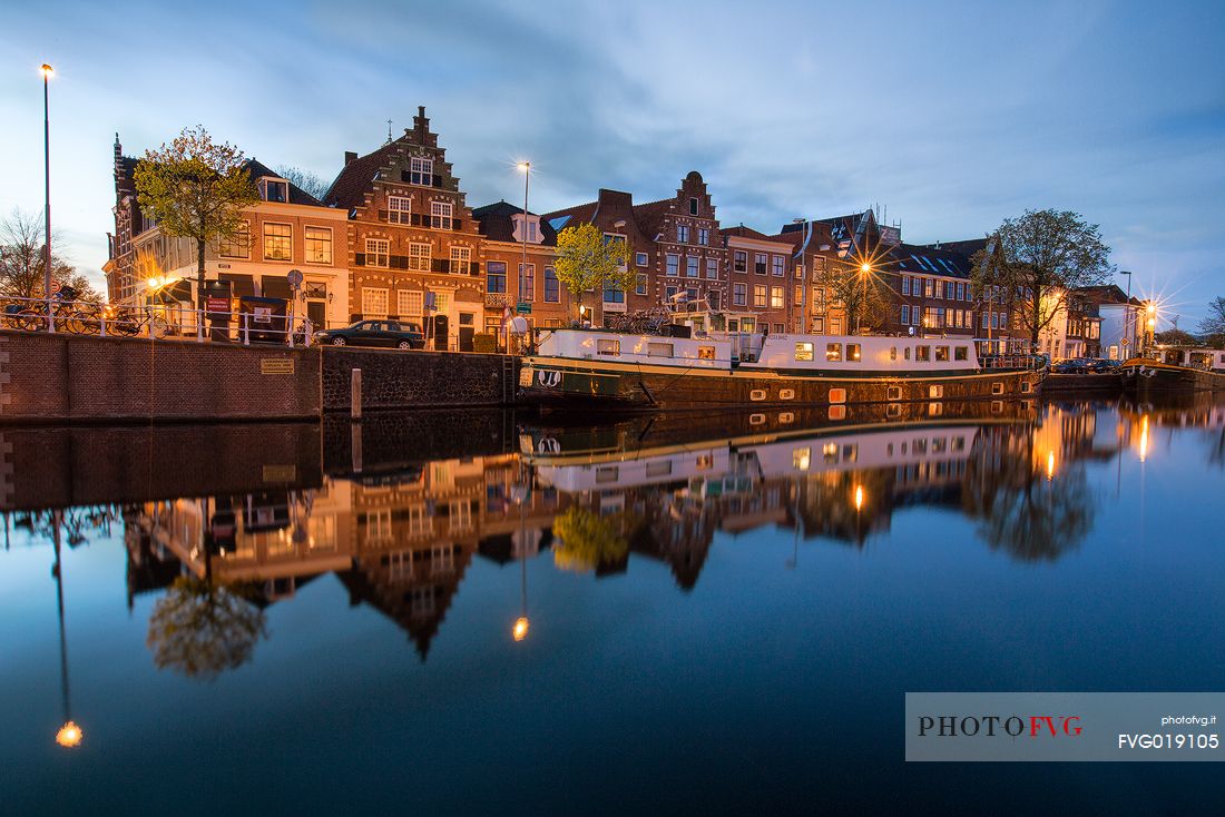 The port area of Haarlem , the capital of the Province of North Holland , with houses reflected in the Spaarne canal