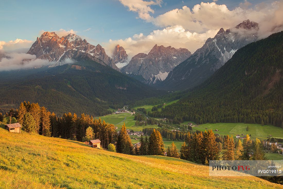 The village of Moos and Sesto dolomites in the background at sunset, Pusteria valley, italy