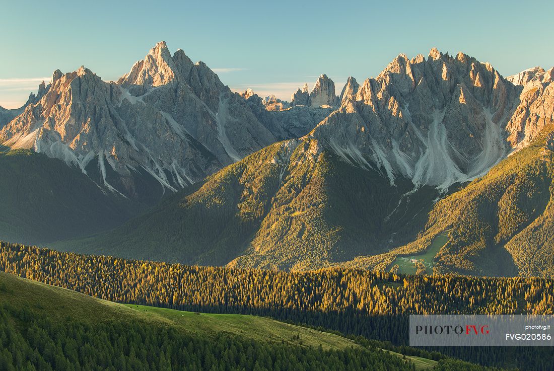 Sesto Dolomites (Cima di Sesto, Punta Tre Scarperi, Tre Cime di Lavaredo and Rocca dei Baranc) from Bonner refuge in Dobbiaco at dawn, 