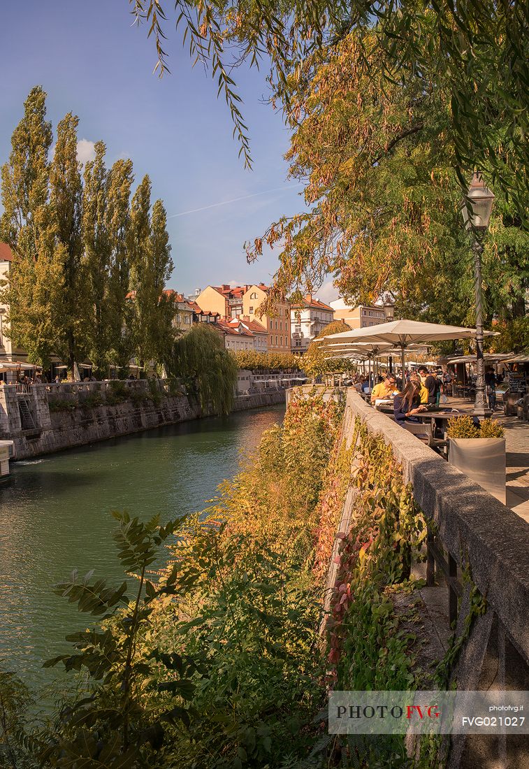 Outdoor bar along the promenade that runs along the Ljubljanica river that runs through the city of Lubiana, Slovenia, Europe