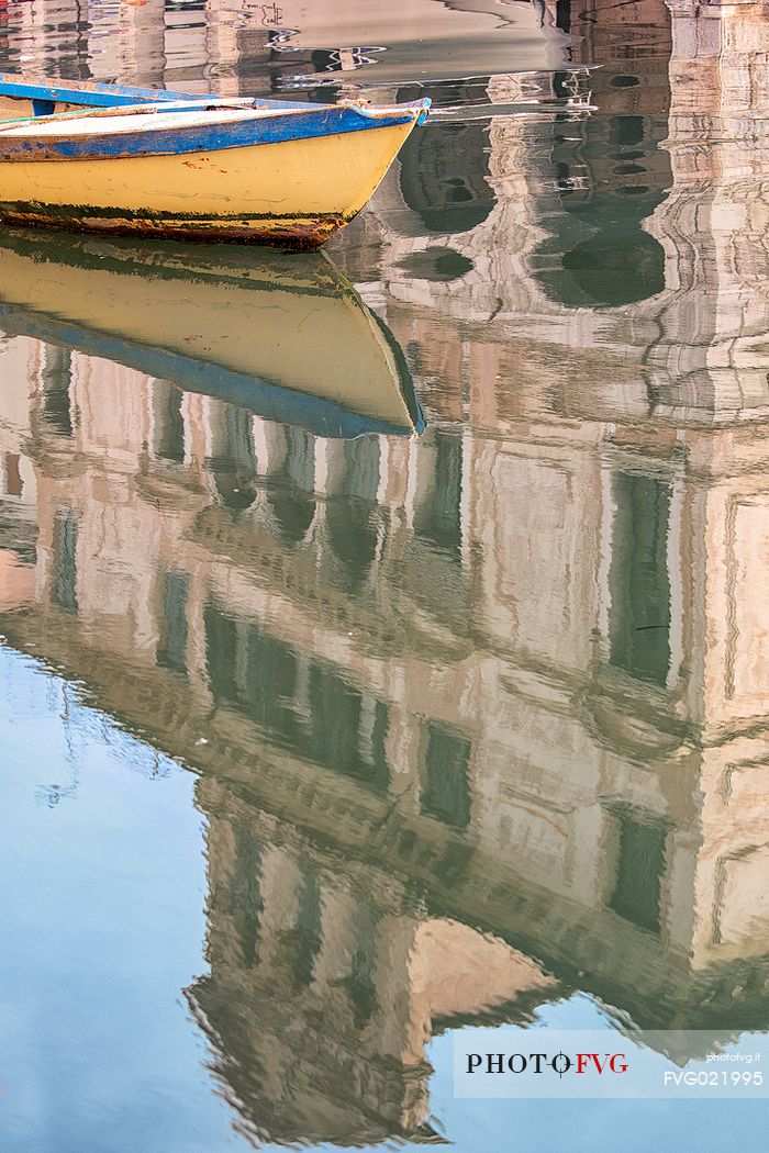 Palazzo Lisatti-Mascheroni reflected on the waters of the canal Vena, Chioggia, Italy