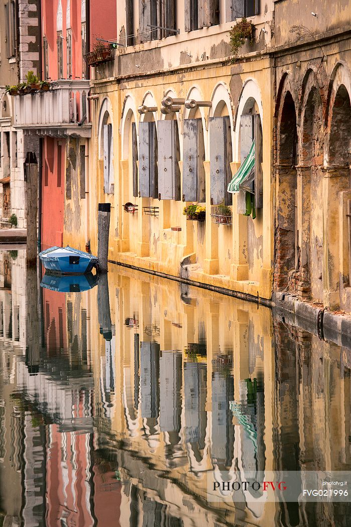 Old palaces reflected along the canal Vena, Chioggia, Italy