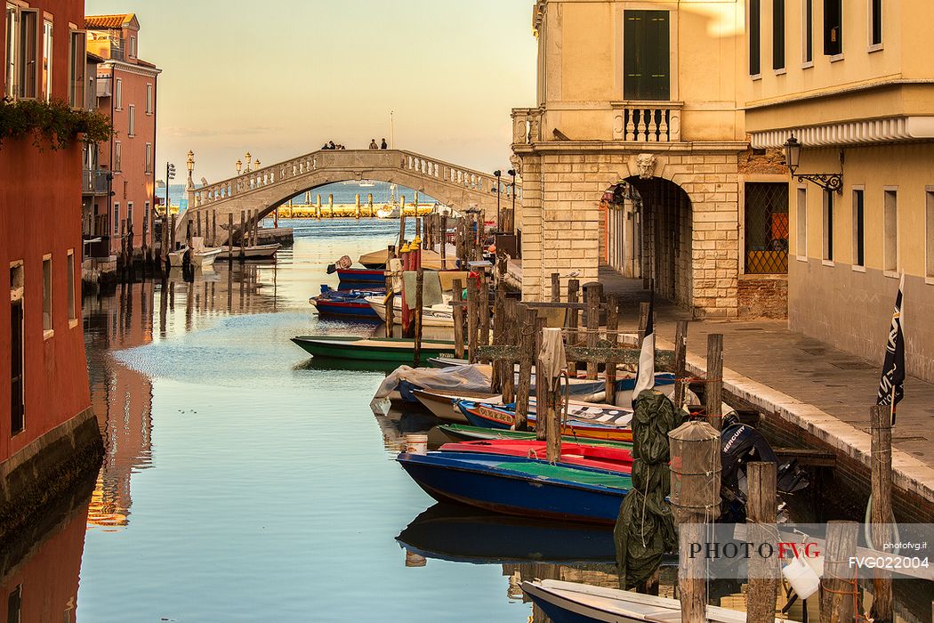 Sunset from Canal Vena to Grassi palace and Vigo bridge, Chioggia, Italy