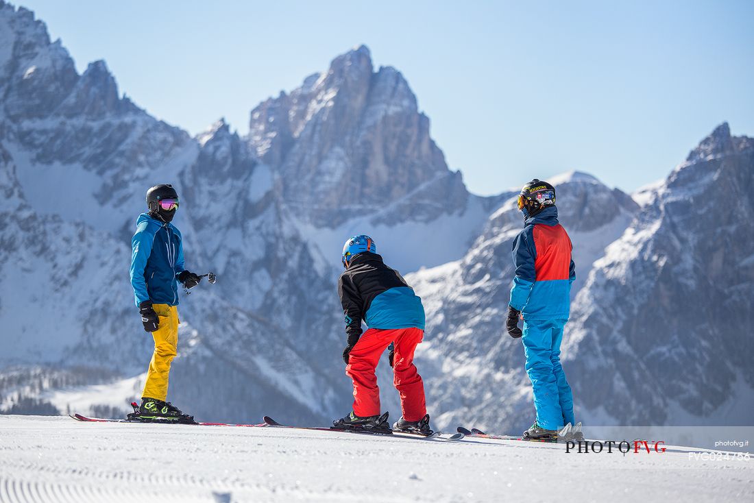 Group of skiers on Mount Elmo, in the background the Croda Dei Toni in the Sesto dolomites natural park, Pusteria valley, Italy