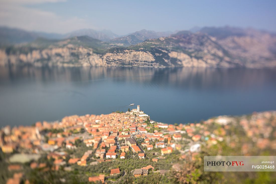 View from the top of the small medieval village of Malcesine with the Scaligero castle overlooking Garda lake, Italy