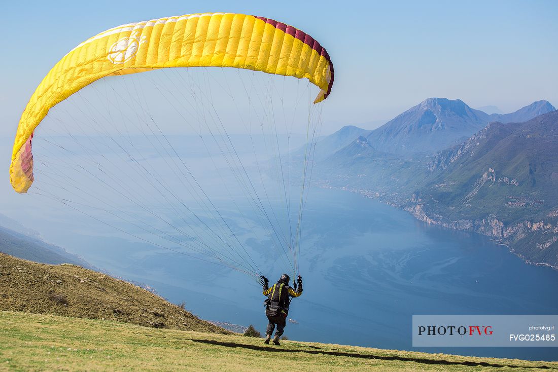 Paragliding runs from Mount Baldo above  Garda lake, Italy