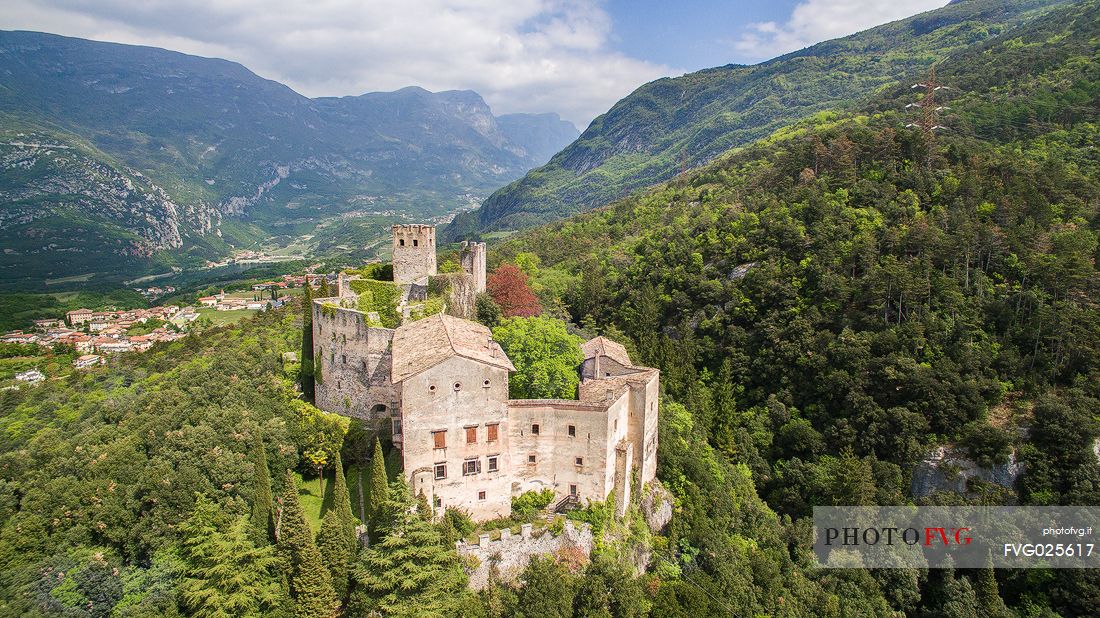Castle Madruzzo from above, a medieval castle set on a rocky hill overlooking the homonymous village, Valley of Lakes, Valle dei Laghi, Trentino, Italy 