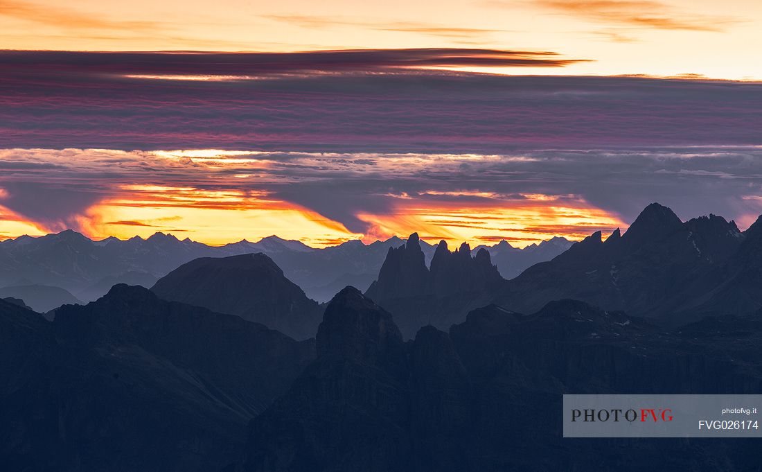 Fiery sunset on the Odle group from the Lagazuoi refuge, Cortina D'Ampezzo, Dolomites, Italy