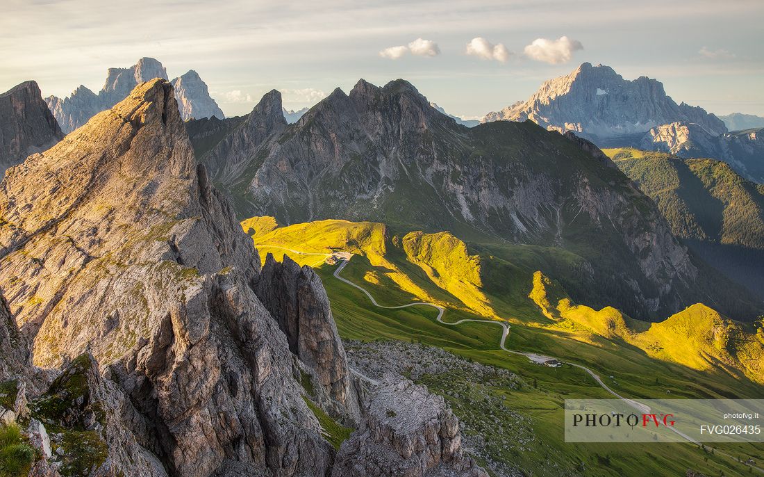 Panoramic view of the Giau Pass, in the background the Pelmo and Civetta Mount illuminated by the early morning lights, Dolomites, Cortina D'Ampezzo, Italy