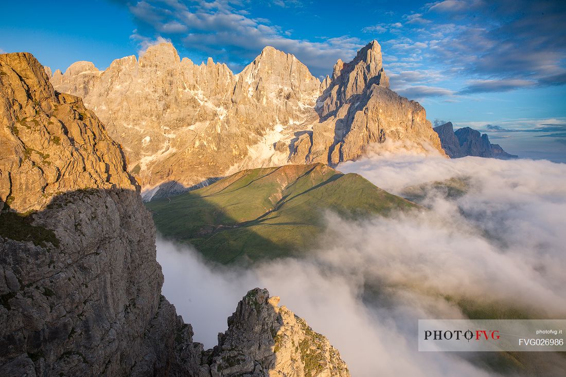 The northern chain of the Pale di San Martino over a cloud of clouds photographed from the top of the path of Cristo Pensante, Dolomites, San Martino di Castrozza, Italy