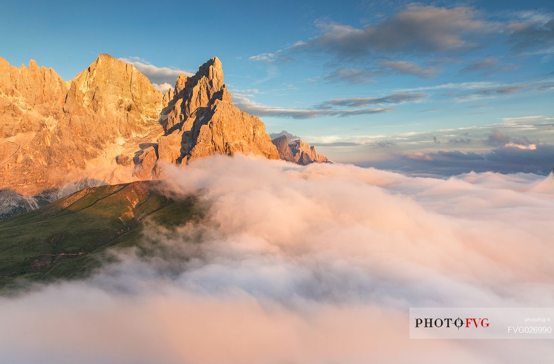 The northern chain of the Pale di San Martino over a cloud of clouds photographed from the top of the path of Cristo Pensante, Dolomites, San Martino di Castrozza, Italy