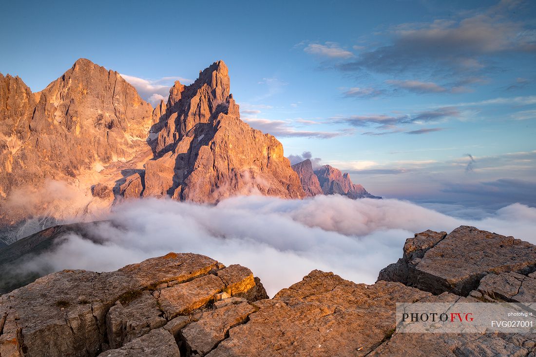 The northern chain of the Pale di San Martino over a cloud of clouds photographed from the top of the path of Cristo Pensante, Dolomites, San Martino di Castrozza, Italy