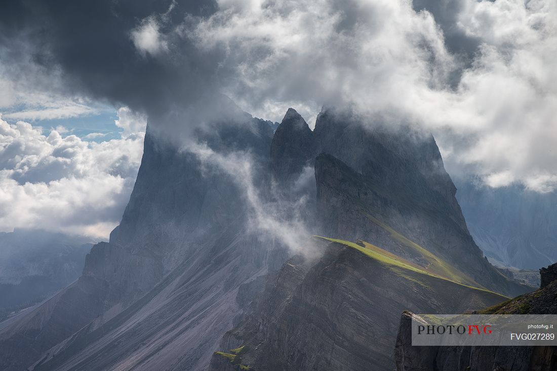 The Odle group wrapped in clouds after thunderstorms photographed from Seceda, Dolomites, Ortisei, Italy The Odle group wrapped in clouds after thunderstorms photographed from Seceda, Dolomites, Ortisei, Italy