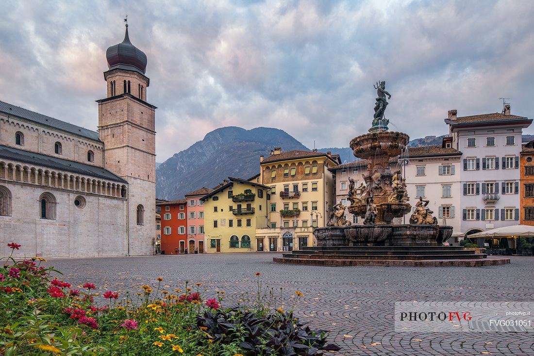 Duomo square with the Cathedral of San Vigilio and the fountain of Nettuno at sunset, Trento, Trentino Alto Adige, Italy