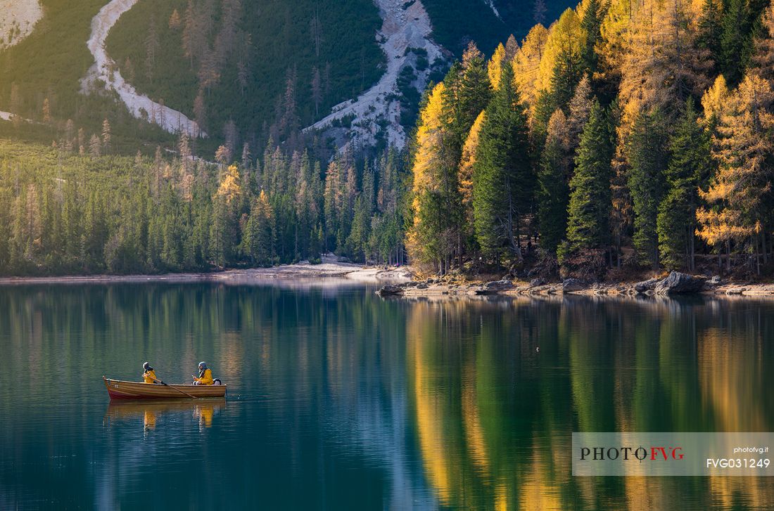 Boat trip on the Braies lake during an autumn morning, Dolomites, Pusteria Valley, Italy