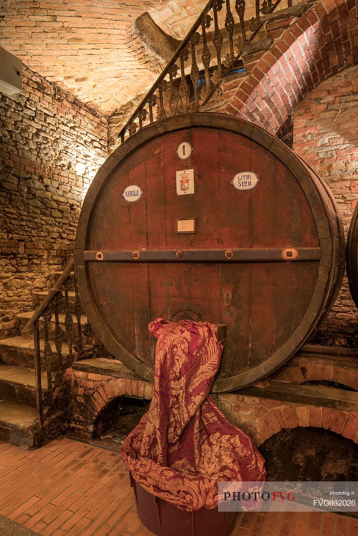 Wooden barrel in the historic wine cellar of Casa E. di Mirafiore e Fontanafredda in Serralunga d'Alba, Langhe, Piedmont, Italy, Europe