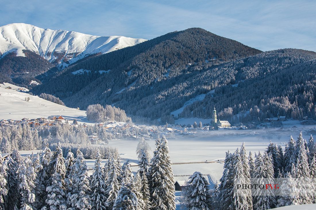 The village of Dobbiaco after an intense snowfall, Pusteria valley, dolomites, Trentino Alto Adige, Italy, Europe