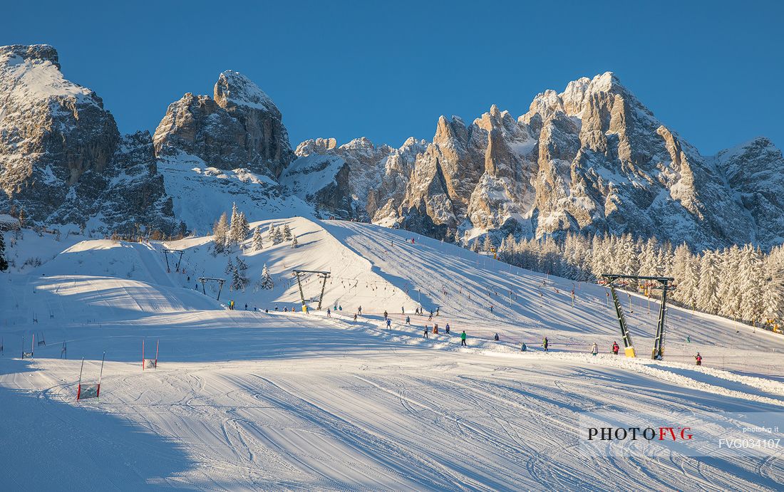 Skiing slopes at the Monte Croce Comelico Pass and in the background the dolomites of Sesto, Pusteria valley, Trentino Alto Adige,Italy