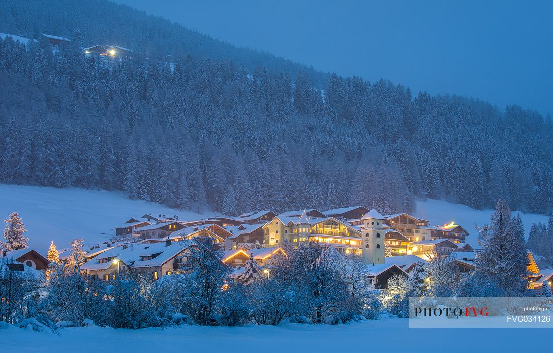 The lights of the Moso' s village in the winter night, Sesto, dolomites, Pusteria valley, Trentino Alto Adige, Italy, Europe