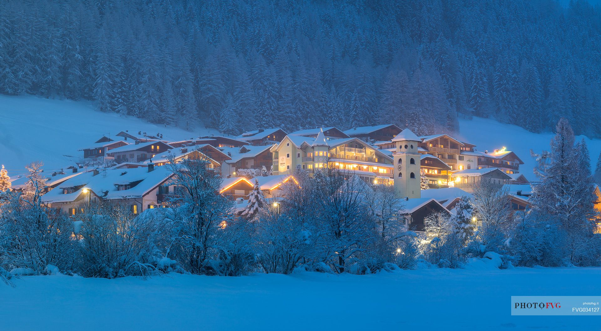 The lights of the Moso' s village in the winter night, Sesto, dolomites, Pusteria valley, Trentino Alto Adige, Italy, Europe