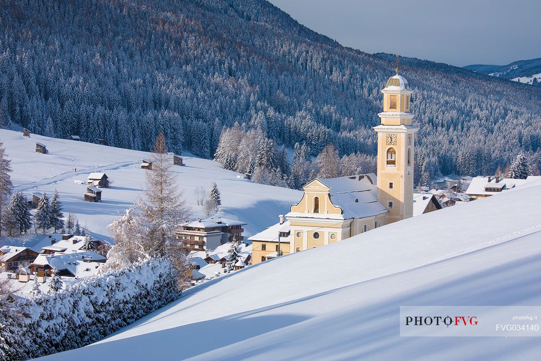 The church of Sesto' s village illuminated at the first light of morning, dolomites, Alta Pusteria valley, Trentino Alto Adige, Italy, Europe