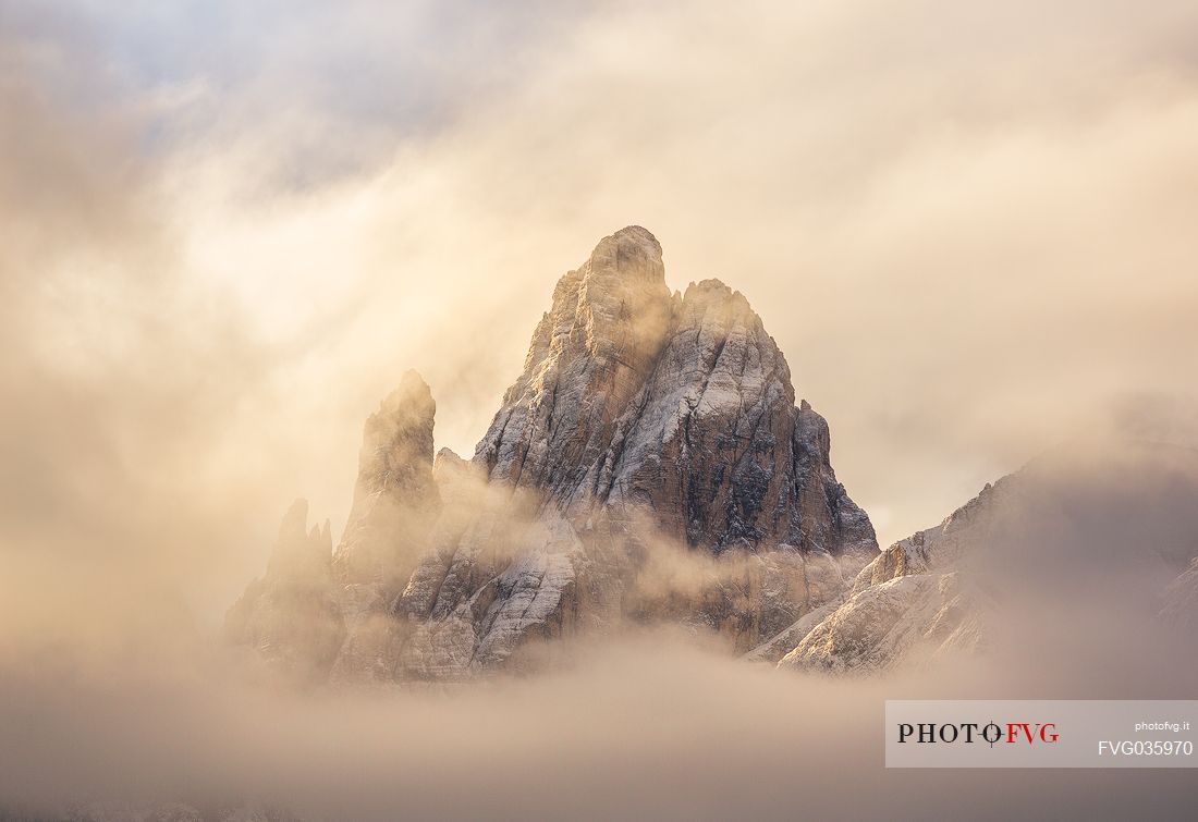 The Croda Dei Toni shrouded by the clouds at dawn, Sesto, Pusteria valley, dolomites, Trentino Alto Adige, Italy, Europe