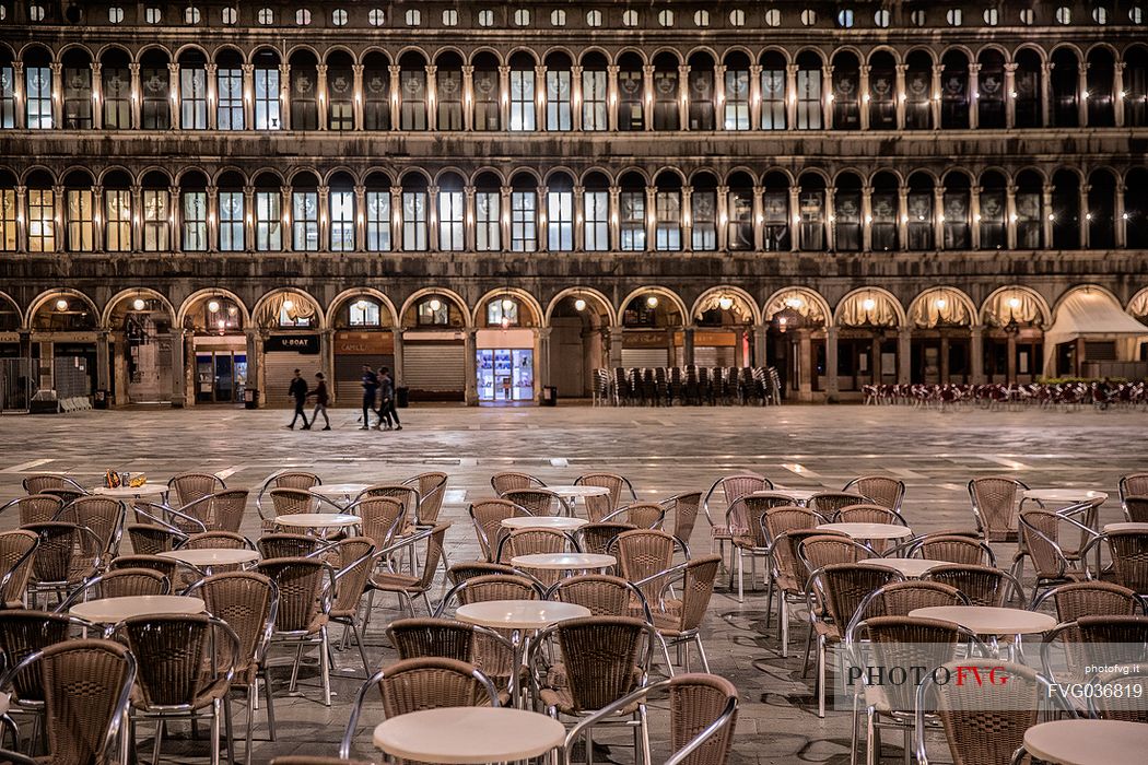 Tables of the most famous bar called Caff Florian in the San Marco square by night, Venice, Italy, Europe
