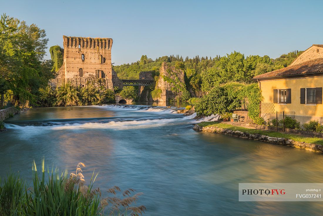 A view of the town of Borghetto, in the background the Visconteo bridge, Valeggio sul Mincio, Veneto, Italy, Europe A view of the town of Borghetto, in the background the Visconteo bridge, Valeggio sul Mincio, Veneto, Italy, Europe