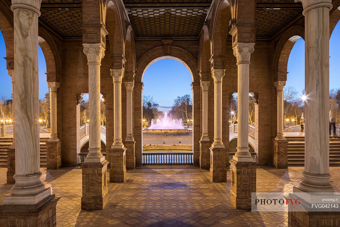 Sunlight and shadows through the pillars ot the Plaza de Espana, Seville, Andalusia, Spain, Europe