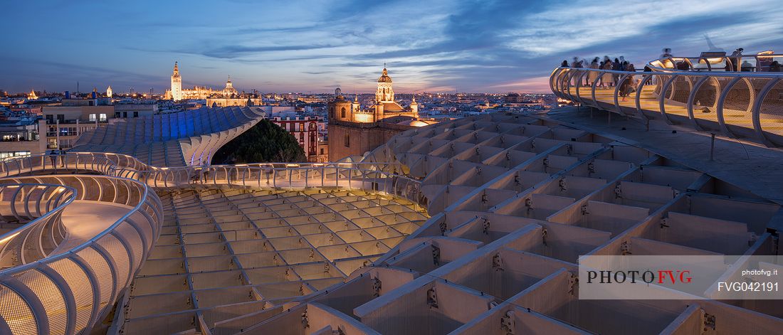 Sunset over the city of Seville from the roof of Metropol Parasol on plaza de la Encarnacion, commonly called Setas, a contemporary architecture project built entirely of wood, Seville, Andalusia, Spain, Europe