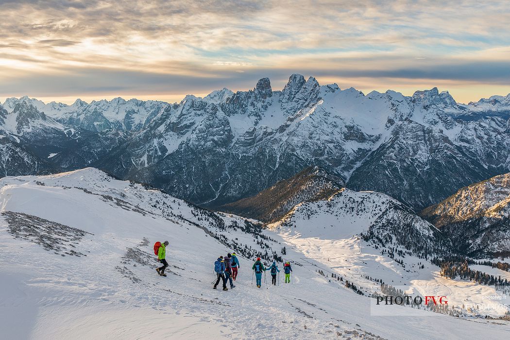 Hikers descend the mountain to Prato Piazza, on background Piz Popena and Cristallo Mount, Fanes Senes Braies Natural Park, Pustertal, dolomites, South Tyrol, Italy, Europe