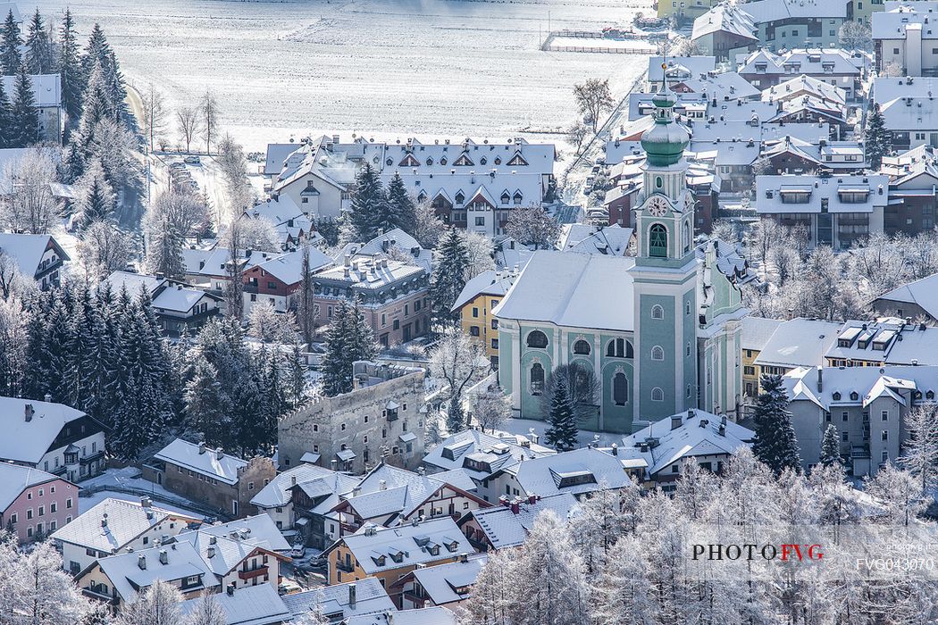 View from above of the village of Dobbiaco after an intense snowfall, Pusteria valley, dolomites, Trentino Alto Adige, Italy, Europe View from above of the village of Dobbiaco after an intense snowfall, Pusteria valley, dolomites, Trentino Alto Adige, Italy, Europe