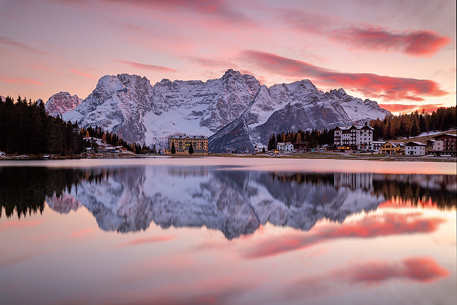 The Sorapiss reflected on the Misurina lake  during a fiery sunset