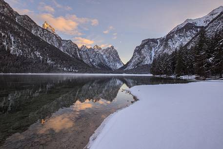 The last light on the Dobbiaco lake during a cold winter atmosphere 