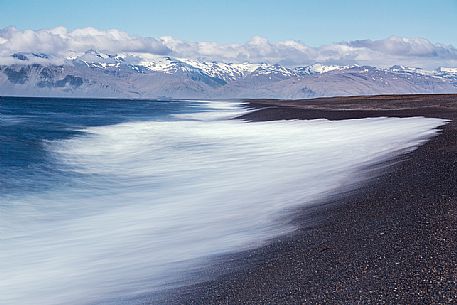 Waves crashing on the black beach in the east coast of Iceland