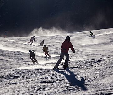 Skiers on the ski slopes of the Elmo Mount in Pustertal