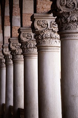Columns and capitals in the Loggia del Lionello, the public building in Venetian Gothic style located in'' Freedom Square'' in the historical center of Udine