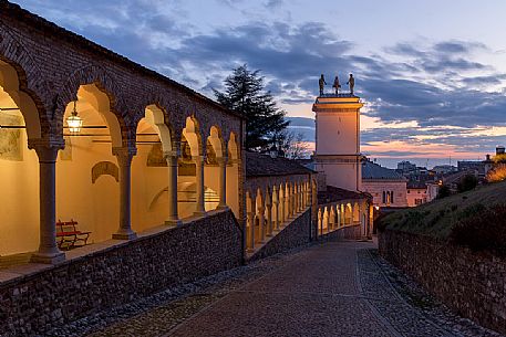 Climb to the castle of Udine and Clock Tower illuminated at blue hour