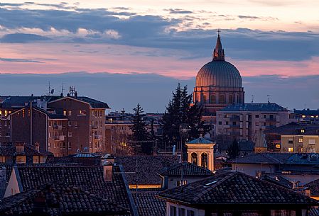 Udine view with the ''Ossario'' temple illuminated  by sunset