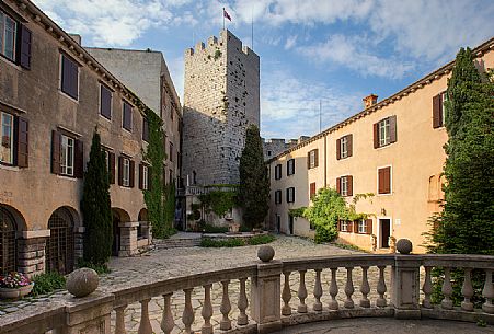 The sixteenth-century tower of the Duino Castle, situated at an angle to the courtyard and protected by a wall shield