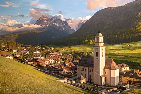 The village of Sesto in the Puster Valley at sunset with the dolomites in the background, Ilay