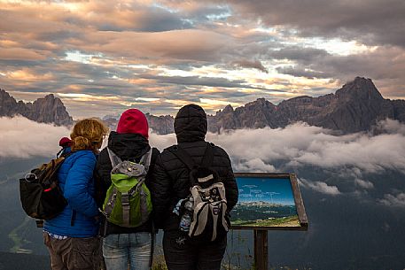 Group of trekkers can enjoy the sunrise on the Sesto Dolomites from Mount Elmo 