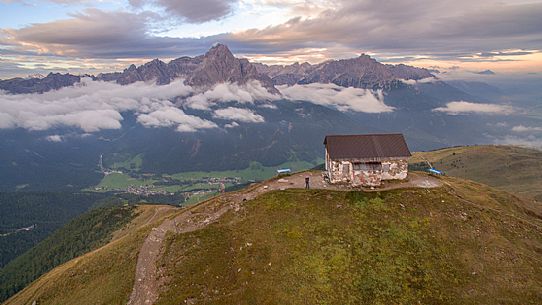 Barracks of Elmo Mount from above and the sesto Dolomites on background at dawn