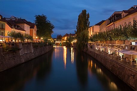 Bars and outdoor restaurants along the Ljubljanica river in Lubiana, Slovenia, Europe