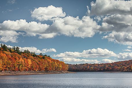 Clouds and autumn colors on lake at Woodstock, Vermont, United States of America