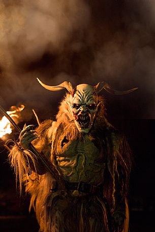 Krampus during the traditional festival. The Krampus are men-wild goats and very disturbing that roam the streets in search of children 