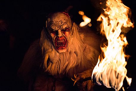 Krampus during the traditional festival. The Krampus are men-wild goats and very disturbing that roam the streets in search of children 