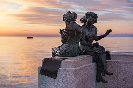 The Sartine, the two famous statues in Trieste at sunset, Italy